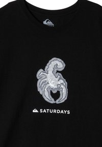 Black cotton t-shirt featuring a grey scorpion graphic and "SATURDAYS" text in white below the design. Round neckline and short sleeves.