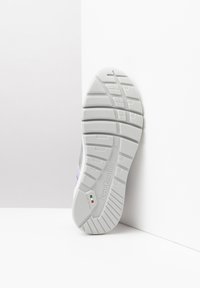 White athletic shoe sole with textured tread patterns. Features a brand logo and markings indicating "Made in Italy" and size 37.