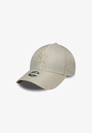 Beige New York Yankees Kappe aus strukturiertem Material mit Logo in einem helleren Farbton. Mit gebogenem Schirm und verstellbarem Snapback-Verschluss.