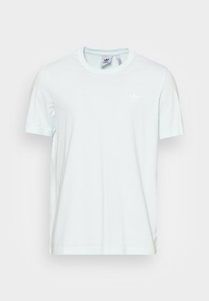 Light blue cotton t-shirt with a round neck and short sleeves. Features a small white branded logo on the chest. Smooth texture.