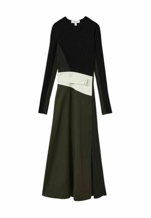 Pikkade varrukatega kleit, millel on tekstuuriga must ülaosa, oliiviroheline seelik ja elevandiluu värvi vöö ümmarguse pandlaga, mis rõhutab värvibloki disaini elemente.
