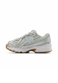 Silver athletic shoe with mesh upper, padded collar, and light blue accents. Rubber outsole features multi-directional treads for traction.