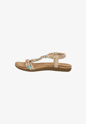 Beige sandal with woven multicolored straps, embellished hardware, flat sole, and ankle strap. Textured surface and cushioned footbed.