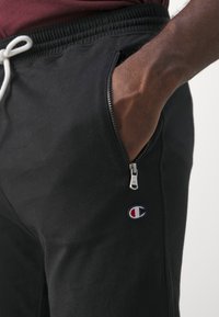Champion ICON PANTS - Tepláky - black