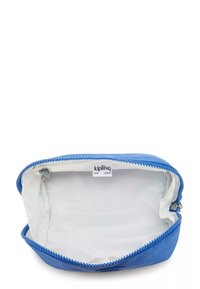 Borsa blu con zip realizzata in tessuto testurizzato. Fodera interna bianca con etichetta "kipling". Design arrotondato, senza tasche esterne o accenti.