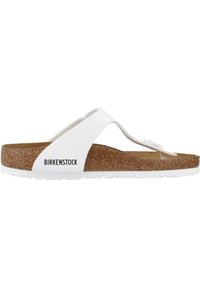 Sandalo flip-flop Birkenstock bianco con plantare in sughero, cinturini bianchi testurizzati e suola in gomma. Nome del marchio stampato sul lato.