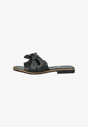 Sandal in pelle nera con design a fiocco annodato sulla parte superiore, suola piatta e punta aperta. Estetica minimale e moderna.