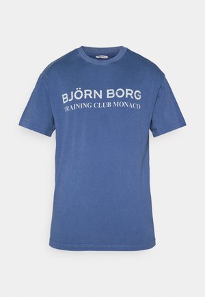 T-shirt de algodão azul com decote redondo, mangas curtas e texto impresso em branco dizendo "BJÖRN BORG TRAINING CLUB MONACO."