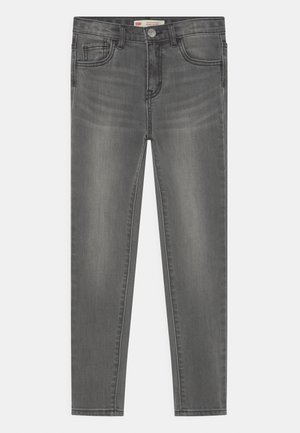 Jeans in denim grigio con una vestibilità slim, dotati di tasche frontali, di un cinturino con passanti e di una leggera scoloritura su tutta la stoffa.