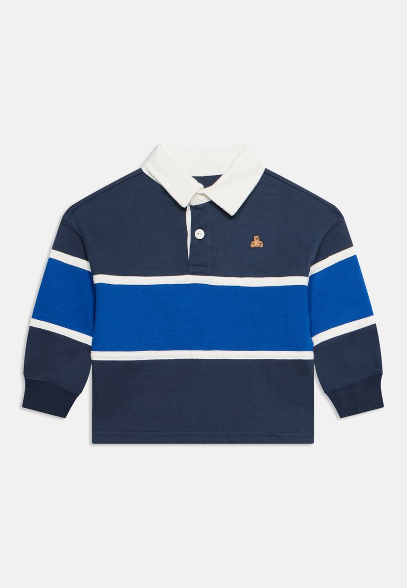 Polo à manches longues bleu marine avec col blanc et rayures horizontales bleues sur la poitrine et les manches, avec un petit logo brodé sur la poitrine gauche.