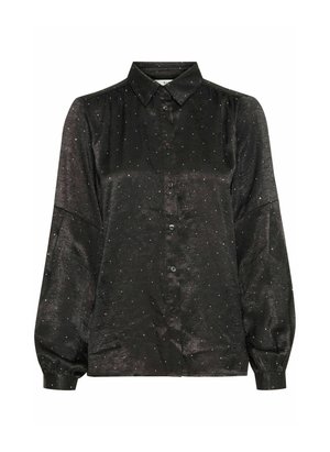 Mustmust shirt pika pikkade varrukatega, valmistatud läikivast kangast, millel on hõbedased metallilised laigud. Tavaline krae ja nööbiga kinnitamine.