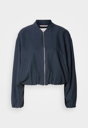Navy bomber jacket with a zip closure, elasticated hem, and long sleeves. Features side pockets and a smooth texture.