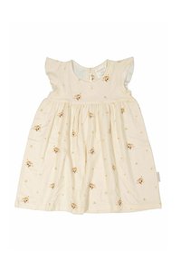 Ljus krämfärgad klänning med korta fjäderlätta ärmar, med ett hundmönster och gula stjärnor. Mjuk tyg, resårlinning i midjan och knäppning bak.