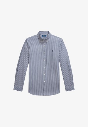 Camisa de hombre de manga larga con botones en rayas verticales en azul marino y blanco, con un cuello nítido y un pequeño logo de pony en el pecho. Tejido de algodón.