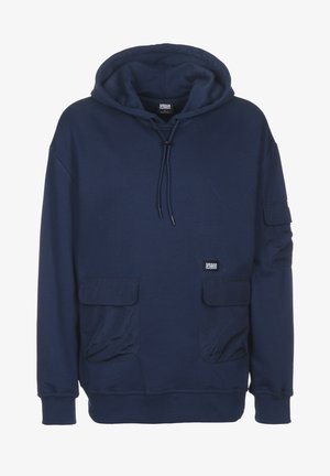 Marineblauwe hoodie van zachte stof, met een voorvak, twee zijzakken, een capuchon met trekkoord en geribbelde manchetten. Urban Classics-label zichtbaar.