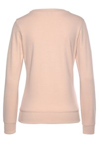Sudadera de algodón rosa claro con mangas largas, cuello redondo, puños y cintura acanalados, textura suave y sin costuras ni detalles visibles.