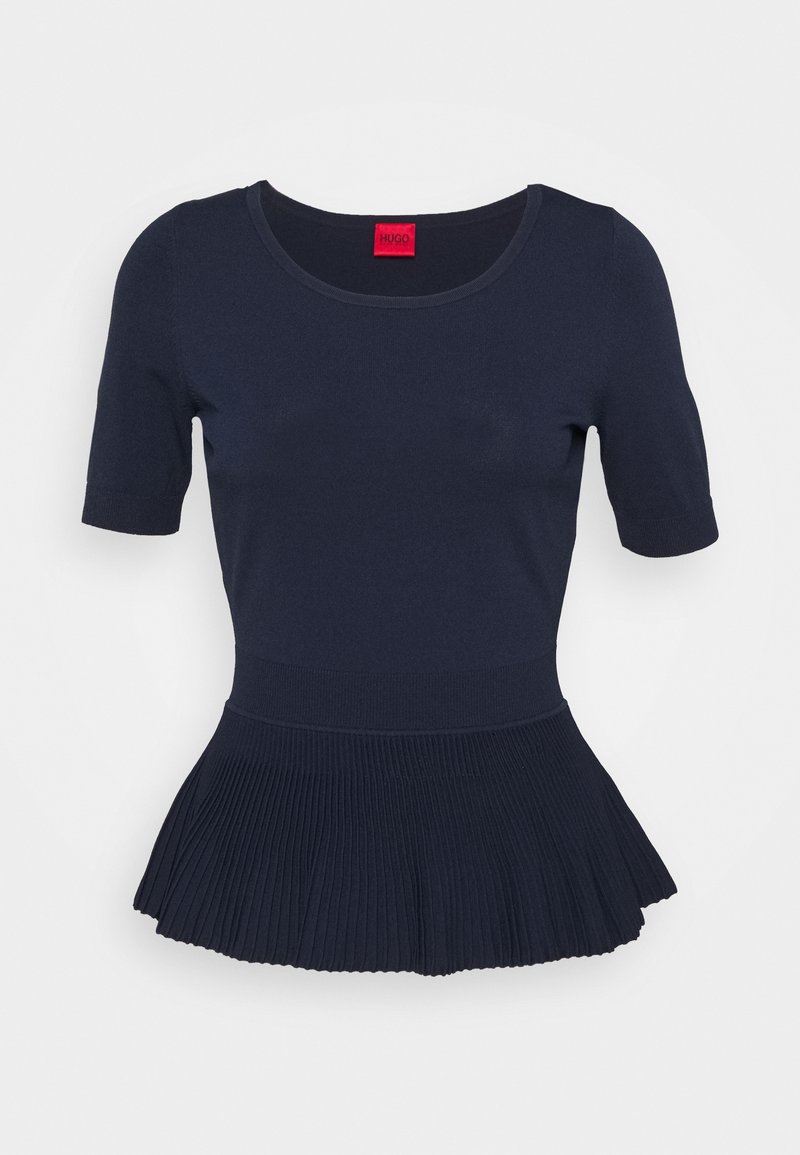 Mörkblå topp med kort ärm och veckad, utsvängd nederkant, tillverkad av ribbat tyg. Har rund halsringning och en röd märkeslapp.