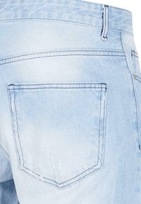 Light blue denim jeans with a faded finish, rear view showcasing a back pocket and stitched seams, featuring a mid-rise waist design.
