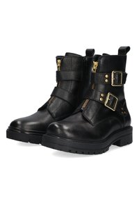 Zwarte leren enkellaarsjes met twee gouden gespen en ritsen, gestructureerde afwerking, chunky rubberen zool en platte hak.