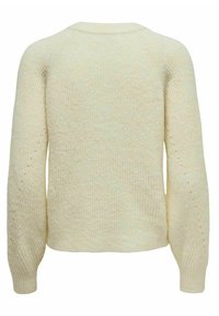 Cream-colored knitted sweater with a textured, chunky design. Features raglan sleeves and a relaxed fit, with ribbed cuffs and hem.