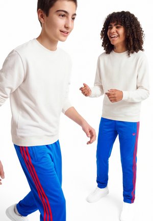 adidas Originals, FIREBIRD TRACK PANTS-JUNIOR UNISEX - Trainingsbroek - blue/semi lucid red