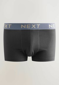 Svarta kalsonger för män med en bred blå elastisk midjeresår som har ordet "NEXT" i beige bokstäver.