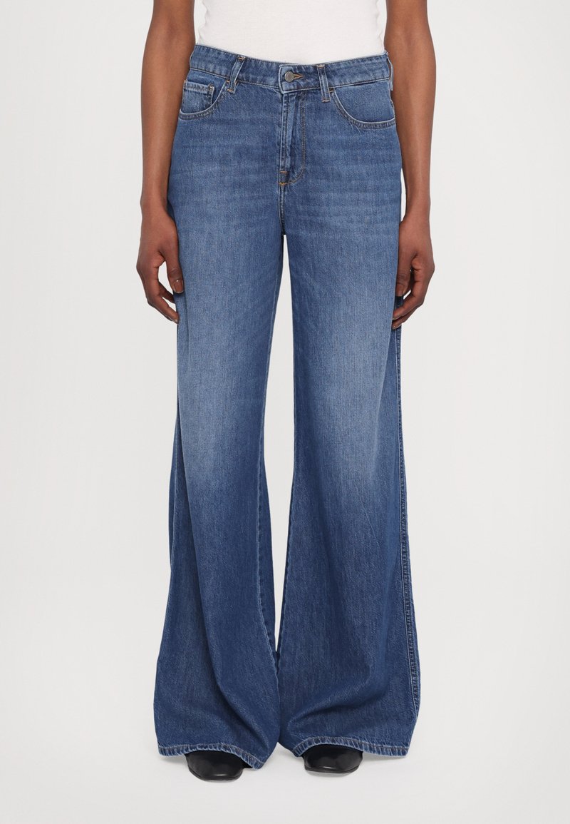 Wide-leg jeans made from blue denim, featuring a high waist, subtle stitching details, and front pockets. Smooth texture and floor-length design.