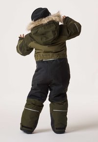 Kids' parka in olive green and black, featuring a faux fur-lined hood, reflective strips, and a waterproof exterior for winter activities.