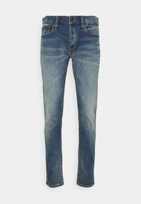 Blå jeans i denim med något blekt utseende, rak benstil, fem fickor och kontrasterande sömnadsdetaljer.