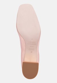 Light pink leather shoe sole with a smooth surface, rounded heel, and embossed branding; marked size 38, made in Italy.
