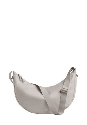 Borsa stile hobo in grigio chiaro, realizzata in tessuto resistente. Presenta una forma curva, una tracolla regolabile e tasche con zip per lo stoccaggio.