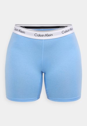 Light blue cotton stretch shorts with a white waistband featuring black "Calvin Klein" branding. Smooth texture and fitted design.