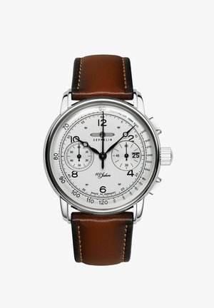 Silver chronograph watch with a white dial, brown leather strap, and black markers. Features two sub-dials and a tachymeter scale.