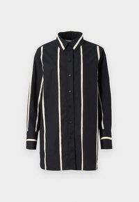 Black long-sleeve shirt with vertical beige stripes, button-up front, classic collar, and contrasting cuffs and collar trim.