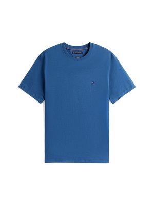 T-shirt de algodão azul com decote redondo, mangas curtas e um pequeno logótipo no lado esquerdo do peito. Textura suave e design casual.