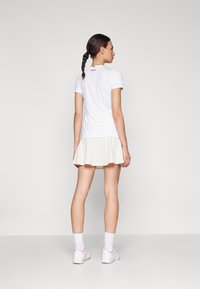 Björn Borg ACE SKIRT POCKET - Αθλητική φούστα - egret