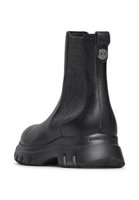 Bottines Chelsea en cuir noir avec des panneaux latéraux en élasthanne, un dos texturé et une épaisse semelle en caoutchouc arborant le logo "VOILE BLANCHE".