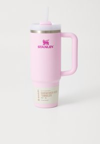 30 oz pink stainless steel tumbler with a straw, a handle, and a matte finish. Features a white cap and a label with product details.