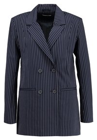 Námořnický dvouřadý blazer s proužky, s klopami, dvěma předními kapsami a černými knoflíky, který má strukturovaný, přiléhavý střih.