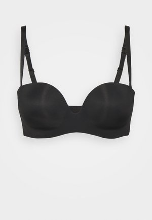 Soutien-gorge en mousse noir avec une texture lisse et mate. Équipé de bretelles ajustables et d'un décolleté subtil au centre. Sans embellissements.