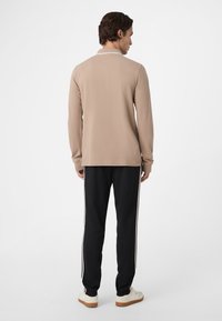 Fila BIELLA REGULAR TAPED - Trainingsbroek - black
