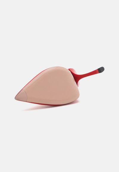 Red and beige shoe with a pointed toe, smooth texture, and a curved heel. Features a contrasting black accent on the heel tip.