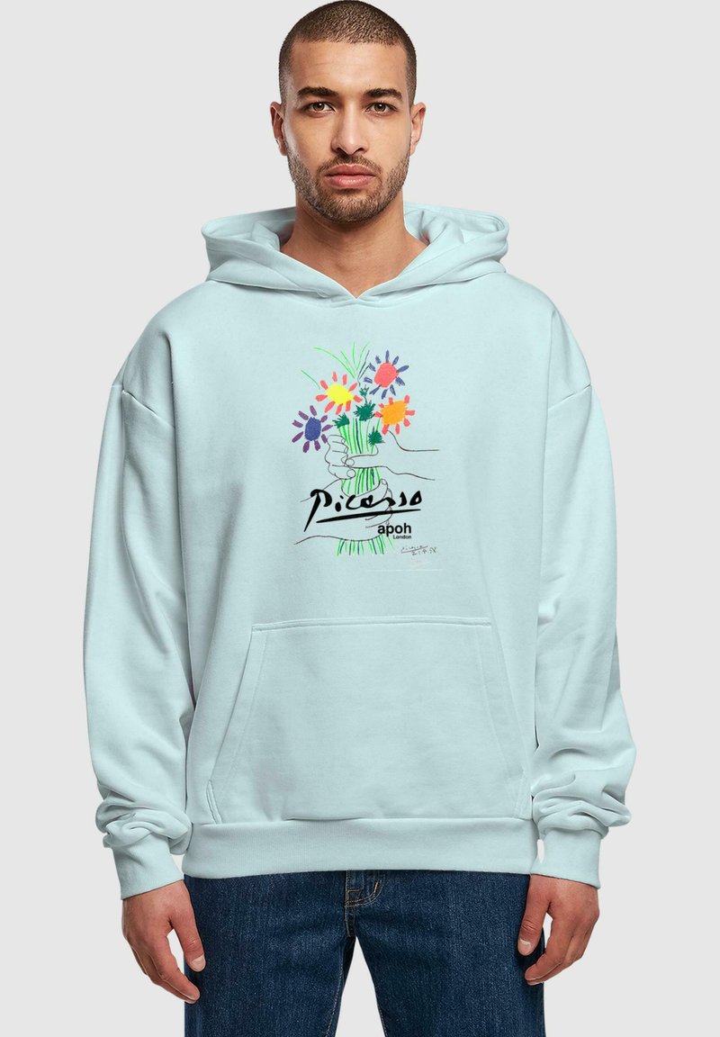 Felpa azzurra chiara con tasca frontale, caratterizzata da un design floreale e testo "Picasso" in nero. Realizzata in tessuto morbido con una vestibilità comoda.