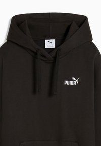 Felpa nera con cappuccio realizzata in tessuto morbido. Caratterizzata da una tasca a marsupio, cappuccio regolabile con cordino e un logo Puma bianco sul petto.