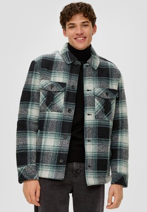 Flanelljacke in Schattierungen von Türkis, Schwarz und Weiß. Mit Kragen, Knopfverschluss, zwei Fronttaschen und einem regulären Schnitt.