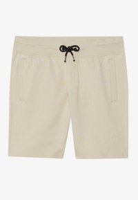 Beige sport shorts med snor i taljen, to sidelommer og et blødt, struktureret stof. Nederkanten falder over knæene.