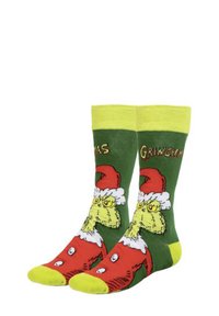Calze verdi con il Grinch dotato di un cappello rosso, accenti gialli e un design giocoso. La scritta recita "GRINCH NATALIZIO". Materiale in maglia morbida.
