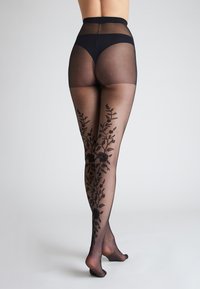 Collant neri a fantasia con tessuto trasparente e ricamo floreale lungo le gambe, design a vita alta e area della punta rinforzata.