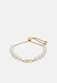 Gold bracelet featuring white pearls, a central gold accent with engraved initials, and an adjustable chain for size flexibility.