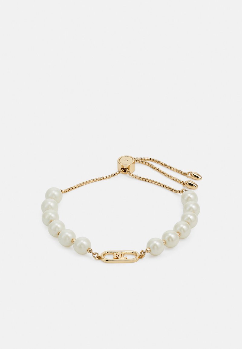 Gold bracelet featuring white pearls, a central gold accent with engraved initials, and an adjustable chain for size flexibility.